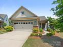 Charming single-Gathering home with a two-car garage, manicured landscaping, and a welcoming front facade at 1026 Kirby Dr, Fort Mill, SC 29715