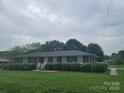 Neat brick home with a manicured lawn and hedges, showcasing a tidy and welcoming exterior at 1165 Mt Moriah Church Rd, China Grove, NC 28023
