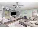 Inviting living room with a large sectional sofa, TV, and stylish decor at 205 Timberfield Trl, China Grove, NC 28023