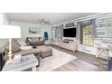 Inviting living room with a large sectional sofa, TV, and stylish decor at 205 Timberfield Trl, China Grove, NC 28023