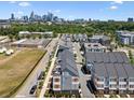 Aerial view of new townhome community, showcasing the neighborhood near the city skyline at 2111 Isom St, Charlotte, NC 28208