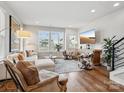 Spacious living room with hardwood floors and large windows for natural light at 2111 Isom St, Charlotte, NC 28208