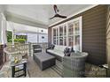 Relaxing back porch with comfortable seating, ceiling fan, and view of the outdoors at 2311 Club Rd, Charlotte, NC 28205
