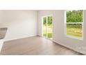 Light-filled living area with granite countertops and a sliding glass door leading to outdoor space at 3332 Burberry Dr, Gastonia, NC 28052