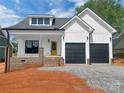 Charming two-story home with a yellow door and a two-car garage at 420 Fulton Dr, Kings Mountain, NC 28086
