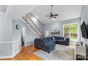 Bright living room with high ceilings, hardwood floors, and large windows offering plenty of natural light at 4927 Gateway Dr, Claremont, NC 28610