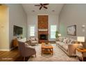 A bright living room featuring a fireplace and neutral decor, creating an inviting and cozy atmosphere at 6007 Kenmore Ln, Indian Trail, NC 28079