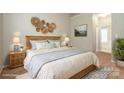 Cozy main bedroom featuring a comfortable king-sized bed, serene decor, and ample natural light at 6007 Kenmore Ln, Indian Trail, NC 28079