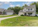 Traditional two-story home with well-manicured lawn, long driveway and ample parking for residents and guests at 636 Sadler Glen Dr, Charlotte, NC 28214