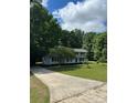 Charming two-story home with well-manicured lawn and long driveway at 7531 Linda Lake Dr, Charlotte, NC 28215