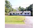 Charming ranch home featuring a large front yard and a blue front door at 854 Silver Fox Dr, Concord, NC 28025