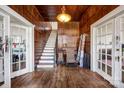 Grand foyer showcasing a staircase, hardwood floors, and vintage charm at 121 York St, Chester, SC 29706