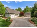 Long driveway leading to a spacious three car garage and additional one car garage in the rear at 174 Buffalo Creek Dr, Statesville, NC 28677