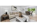 Open-concept living room seamlessly connects to the dining area, perfect for entertaining guests with neutral decor at 200 Kimrod Ln, Charlotte, NC 28270