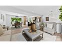 Bright open-concept space connects the living room, kitchen, and dining areas with cohesive design at 200 Kimrod Ln, Charlotte, NC 28270