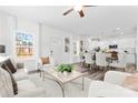 Open-concept living area with dining space, plush seating, and ample natural light at 2123 Gemway Dr, Charlotte, NC 28216