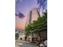 Exterior of modern building with a sleek glass facade and surrounding trees and an amazing view at 315 Arlington Ave # 1104, Charlotte, NC 28203