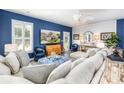 Comfortable living room with stylish furniture, large windows, and a modern ceiling fan to enjoy the space at 3619 Whitney Way, Terrell, NC 28682