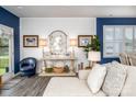 Bright and inviting living room features chic decor, accent lighting, and a view to the backyard at 3619 Whitney Way, Terrell, NC 28682