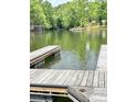 View of an empty wooden dock on the lake at 5933 Flintlock Ct, Hickory, NC 28601