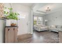 Inviting living room featuring hardwood floors, a bright window, and neutral décor creating a cozy atmosphere at 6040 Fazio Ct, Harrisburg, NC 28075
