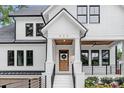 Charming white two-story home with a welcoming front porch and well-maintained landscaping at 632 Dorothy Dr, Charlotte, NC 28203