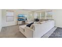 Comfortable living room featuring plush seating, a large TV, and ample natural light at 804 Yorkshire Dr, Albemarle, NC 28001