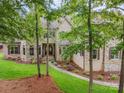Charming brick and stone home with manicured landscaping, stone walkway, and a covered front entrance at 925 Giacomo Dr, Waxhaw, NC 28173