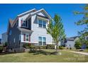 Two-story home with stone accents and a manicured lawn, offering charming curb appeal at 990 Nw Capwalk Nw Rd # 138, Concord, NC 28027