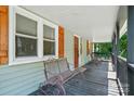 Inviting front porch with bench seating and a charming atmosphere at 139 5Th St, Huntersville, NC 28078