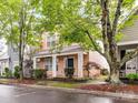 Charming two-story home with a welcoming front porch and well-manicured landscaping at 240 Faust Rd, Davidson, NC 28036