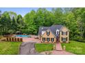 Two-story home featuring a pool, fenced-in backyard, and circular driveway at 3125 Arden Way, Claremont, NC 28610