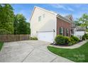 Spacious two-car garage with extended driveway and lush landscaping at 4015 Amber Leigh Way Dr, Charlotte, NC 28269