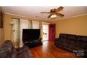 Inviting living room with hardwood floors and comfortable brown furniture at 615 Mauney Ave, Kings Mountain, NC 28086