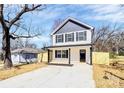 Two-story home with a covered front porch, gray and white color scheme, and newly seeded yard at 624 W Kerr St, Salisbury, NC 28144