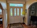 Welcoming foyer with stained glass door, hardwood floors and arched doorway at 800 Warrington Pl, Rock Hill, SC 29732
