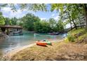 Picturesque waterfront with boats, docks, sandy beach, and crystal clear water at 9066 Tulagi Ct, Tega Cay, SC 29708