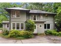 Back exterior view of a home with a well-manicured lawn, and a back door at 920 Queens Rd, Charlotte, NC 28207