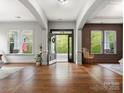 Spacious foyer with hardwood floors, an open front door and an abundance of natural light at 1515 Millbridge Pkwy, Waxhaw, NC 28173