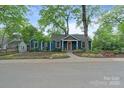 Landscaped front yard and blue exterior showcase this charming home's curb appeal at 1933 Thurmond Pl, Charlotte, NC 28205