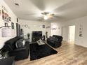 Comfortable living room with black sofas and a cozy atmosphere at 205 E Maine Ave, Bessemer City, NC 28016