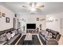 Cozy living room features hardwood floors and a large TV for entertainment at 205 E Maine Ave, Bessemer City, NC 28016