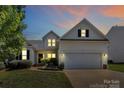 Charming two-story home with a well-manicured lawn, attached two car garage, and inviting curb appeal at 2111 Savoy Pl, Fort Mill, SC 29707