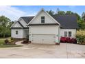 Well-maintained two-story home with a black roof, white siding, a two-car garage, and a concrete driveway at 2336 Beth Haven Church Rd, Denver, NC 28037