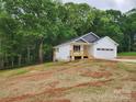Well-maintained single-story home with a side entry porch and a two-car garage at 2514 Oak Valley Ln # 4 & 5, Maiden, NC 28650