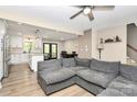 Open-concept living room flowing into a stylish kitchen, perfect for entertaining, exudes warmth and style at 2780 China Grove Rd, Kannapolis, NC 28083