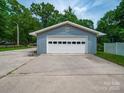 Spacious detached garage with a wide door for easy vehicle access at 3313 Lancaster Hwy, Monroe, NC 28112