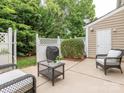 Private patio area with comfortable seating, perfect for outdoor relaxation and entertaining guests at 413 River Park Rd, Belmont, NC 28012