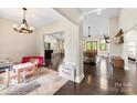 Open-concept layout featuring hardwood floors, neutral walls, and transitional decor, blending play and gathering spaces at 4453 Buffalo Shoals Rd, Maiden, NC 28650