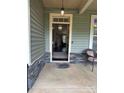 Welcoming front porch featuring stone accents, overhead lighting, and a view into the home's interior at 4561 N Wynswept N Dr, Maiden, NC 28650